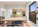 Kitchen with stainless steel appliances, butcher block island, updated lighting, and ample storage at 4673 Bryant St, Denver, CO 80211