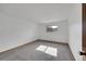 Clean, carpeted bedroom with neutral walls and a window providing natural light at 420 Zang St # 108, Lakewood, CO 80228