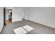 This bedroom features neutral carpet, light walls, and a closet with mirrored doors at 420 Zang St # 108, Lakewood, CO 80228