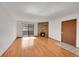 Bright living room featuring hardwood floors, a cozy stone fireplace, and sliding glass doors at 420 Zang St # 108, Lakewood, CO 80228
