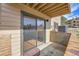 Cozy outdoor patio with brick border, sliding glass doors, and space for outdoor seating at 420 Zang St # 108, Lakewood, CO 80228