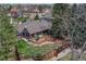 This aerial view showcases the home nestled in a neighborhood with lush landscaping at 11838 W Arlington Dr, Littleton, CO 80127