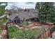 A spacious fenced backyard features a wooden deck and a well-manicured lawn at 11838 W Arlington Dr, Littleton, CO 80127