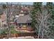 A spacious fenced backyard features a wooden deck, a patio, and mature landscaping at 11838 W Arlington Dr, Littleton, CO 80127