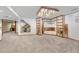 Large finished basement features built-in shelves, cabinets, and unique lighting at 11838 W Arlington Dr, Littleton, CO 80127