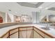 Finished basement featuring a bar, and view of the living room and shelves at 11838 W Arlington Dr, Littleton, CO 80127
