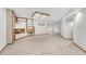 Spacious basement with neutral carpet, shelves, and recessed lighting at 11838 W Arlington Dr, Littleton, CO 80127