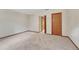 Finished bedroom with neutral carpet and walls at 11838 W Arlington Dr, Littleton, CO 80127