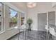 Cozy breakfast nook featuring bright windows, neutral colors, and tile floors, perfect for morning coffee at 11838 W Arlington Dr, Littleton, CO 80127