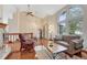 Bright living room with vaulted ceilings, large windows, and an open floor plan at 11838 W Arlington Dr, Littleton, CO 80127
