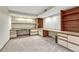 Finished office space with neutral carpet, lots of cabinets and counter space at 11838 W Arlington Dr, Littleton, CO 80127