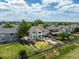 Aerial view of the home showcases backyard with deck, patio, and lush lawns in a desirable neighborhood at 11256 Lima St, Commerce City, CO 80640