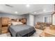 Basement bedroom featuring neutral tones, a comfortable bed, and ample storage space at 11256 Lima St, Commerce City, CO 80640