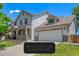 Charming two-story home with a well-manicured lawn and attached two-car garage on a sunny day at 11256 Lima St, Commerce City, CO 80640