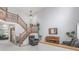 Bright foyer with a staircase, neutral paint, and plants adding warmth to the entrance at 11256 Lima St, Commerce City, CO 80640