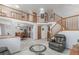 Open foyer with a wooden staircase, flowing into the dining area and living spaces at 11256 Lima St, Commerce City, CO 80640
