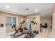 Finished basement with a home gym that has exercise equipment and wood floors at 11256 Lima St, Commerce City, CO 80640