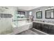 Elegant main bathroom featuring a soaking tub, separate shower, and dual sink vanity at 11256 Lima St, Commerce City, CO 80640