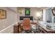Home office with a sleek workspace, computer monitors, and a comfortable desk chair at 11256 Lima St, Commerce City, CO 80640