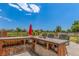 Outdoor kitchen features a countertop bar, grill, and open views at 11256 Lima St, Commerce City, CO 80640