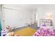 Comfortable bedroom with closet, adjacent rooms, and view to toys at 16423 Mountain Flax Dr, Monument, CO 80132