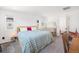 Bright bedroom featuring a plush bed, bedside table, and crib at 16423 Mountain Flax Dr, Monument, CO 80132