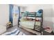 Bright bedroom featuring bunk beds and a charming window view at 16423 Mountain Flax Dr, Monument, CO 80132