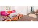 Bright bedroom features a colorful rug, seating area, and cheerful decor at 16423 Mountain Flax Dr, Monument, CO 80132