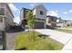 Attractive gray two-story home with a well-maintained lawn, fresh landscaping and a wide driveway at 16423 Mountain Flax Dr, Monument, CO 80132