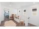 Bright hallway with a chair and a view into other rooms at 16423 Mountain Flax Dr, Monument, CO 80132