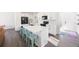 Bright kitchen with white cabinetry, quartz countertops, and a central island with seating at 16423 Mountain Flax Dr, Monument, CO 80132