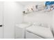 Clean laundry room with appliances and storage space at 16423 Mountain Flax Dr, Monument, CO 80132