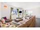 Inviting living room featuring a plush sectional sofa, large windows, and stylish decor at 16423 Mountain Flax Dr, Monument, CO 80132