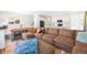Spacious living room with a large sectional sofa, open to the kitchen, and modern finishes at 16423 Mountain Flax Dr, Monument, CO 80132