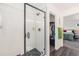 Modern bathroom featuring a glass shower enclosure and neutral tiling at 16423 Mountain Flax Dr, Monument, CO 80132