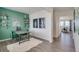 Stylish dining area featuring a modern table, unique decor, and hardwood floors at 779 N Deer Park St, Watkins, CO 80137