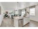 Open kitchen with granite countertops, stainless appliances and a view to the living and dining spaces at 779 N Deer Park St, Watkins, CO 80137