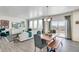 Bright living area featuring an island kitchen, comfortable seating, and modern decor at 779 N Deer Park St, Watkins, CO 80137