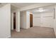 Finished basement area with neutral carpet, storage closets and versatile space at 5808 E Hinsdale Pl, Centennial, CO 80112
