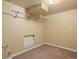 Unfinished basement area, with carpet, access panel, and a metal hanging rod installed at 5808 E Hinsdale Pl, Centennial, CO 80112
