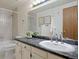 Clean bathroom featuring a vanity with faux marble countertop and tub shower at 5808 E Hinsdale Pl, Centennial, CO 80112