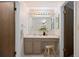 Bathroom featuring a vanity with storage, neutral tile floors, and a bright vanity light at 5808 E Hinsdale Pl, Centennial, CO 80112