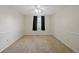 Simple bedroom with carpet, a ceiling fan, and a window with curtains at 5808 E Hinsdale Pl, Centennial, CO 80112