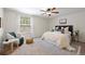 Inviting bedroom with a window, modern furnishings, and neutral tones create a serene space at 5808 E Hinsdale Pl, Centennial, CO 80112