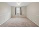 Minimalist bedroom with carpet, a ceiling fan, and a bright window view at 5808 E Hinsdale Pl, Centennial, CO 80112
