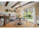 Charming breakfast nook with a view, wood beams, and cozy seating at 5808 E Hinsdale Pl, Centennial, CO 80112