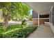 Inviting front porch with charming brick accents and lush landscaping, a welcoming entrance to this lovely home at 5808 E Hinsdale Pl, Centennial, CO 80112