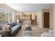 Inviting living room with a large window, modern sofa and staircase access at 5808 E Hinsdale Pl, Centennial, CO 80112