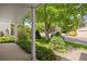 Covered front porch with lush landscaping at 5808 E Hinsdale Pl, Centennial, CO 80112