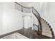 Elegant curved staircase with wrought iron railing at 9647 Colinade Dr, Lone Tree, CO 80124